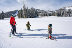 Family of skiers together at Winter Park