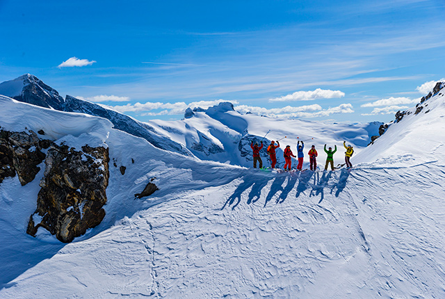 CMH heli skiing, British Columbia Canada, skiers on mountain.