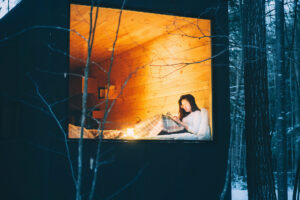 The coolest accomodations near ski resorts, woman reading.