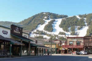 Town of Jackson with snow-covered ski slopes behind it