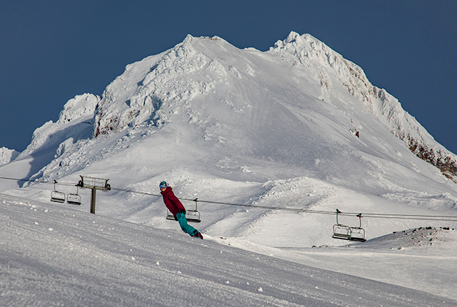 Mt. Hood Meadows bluebird day, snowboarder.