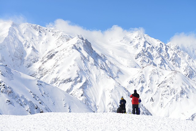 View of the mountains and skiers in Nagano, Japan.