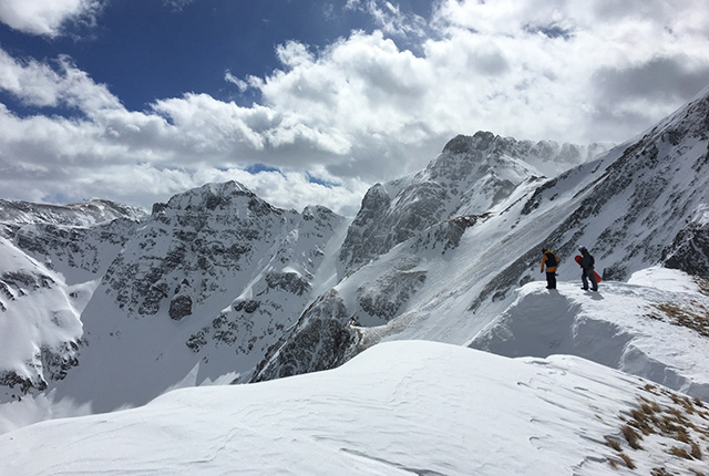 Silverton Mountain, top of peak, snowboarders.