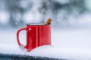 Steam rising above hot drink in the snow