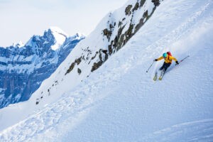 The Best Ski Resorts in the World: Skier on steep run, Chamonix France.