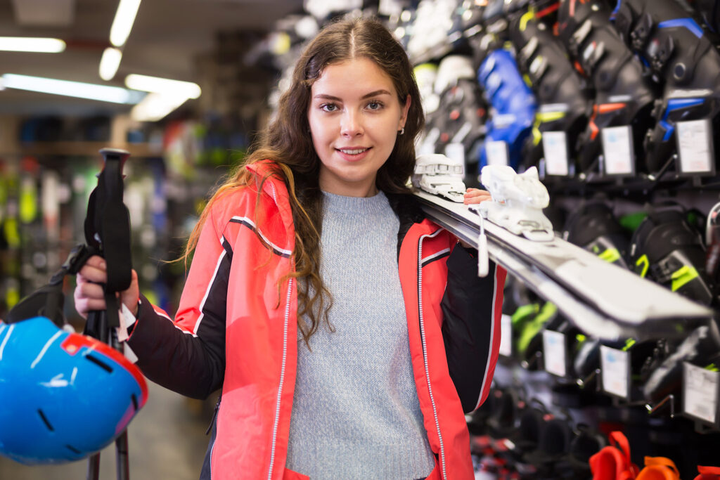 Which ski is right for you, woman holding skis.